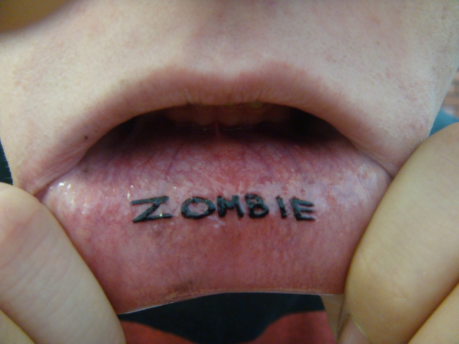 Tattoo was done by D'wan Ellington of Under the Gun Inc. Zombie Lip tattoo